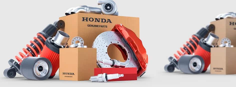 Honda auto parts including filters, spark plugs, and a brake disc with packaging.